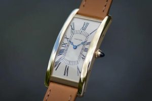 The white dial fake watch has Roman numerals.